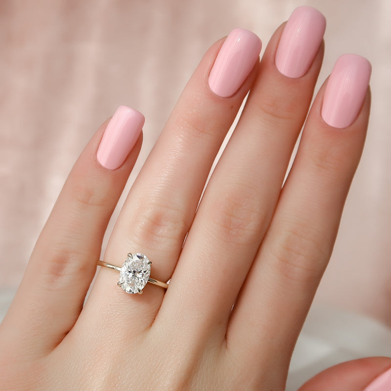The Crown Kamellie Set With A 2 Carat Oval Lab Diamond